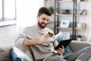 Technology,,People,And,Online,Shopping,Concept,-,Happy,Smiling,Man