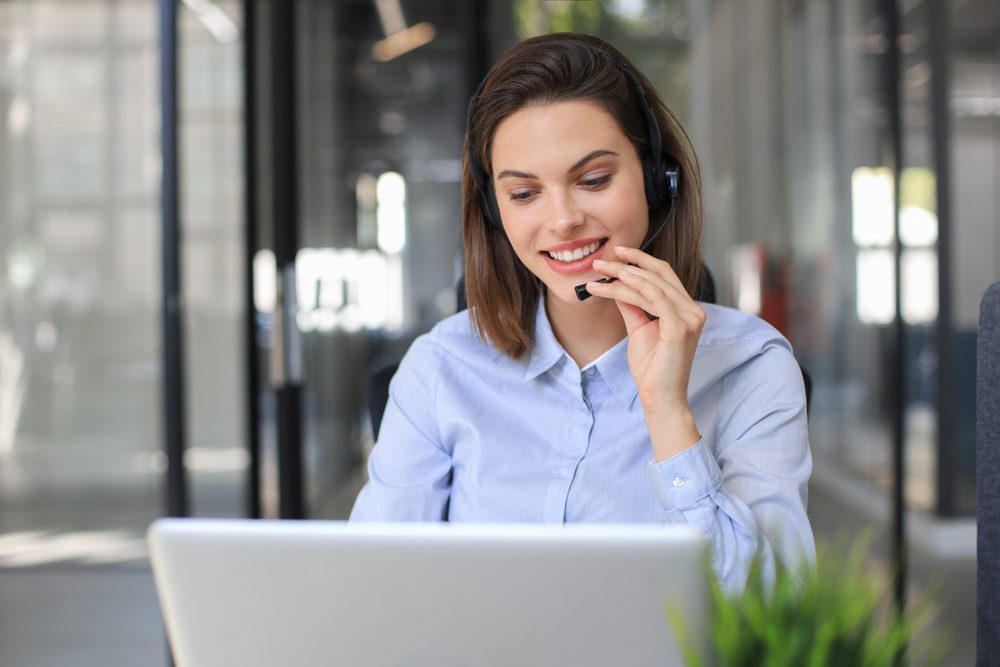 smiling-woman-using-headset