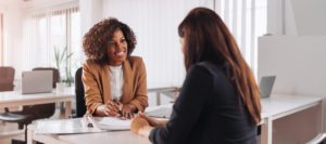 Woman,Consulting,With,A,Female,Financial,Manager,At,The,Bank